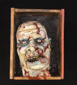 Zombie head in a box