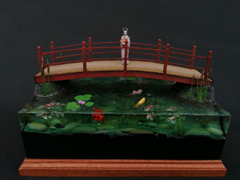 Japanese Geisha on koi pond